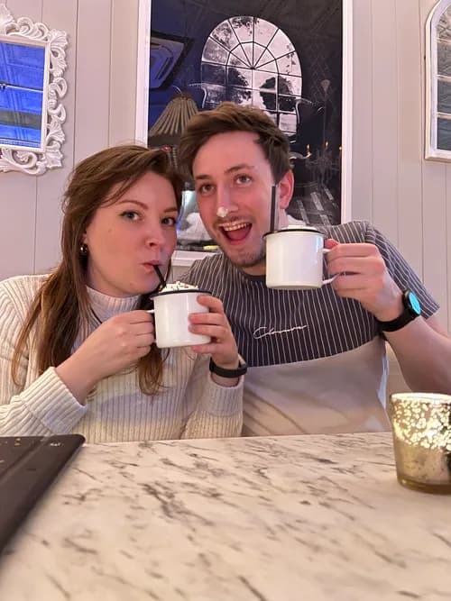 Harriet and Jon enjoying hot drinks together