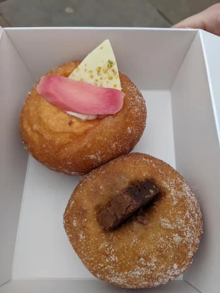A Pinkmans sourdough doughnut topped with rhubarb and chocolate